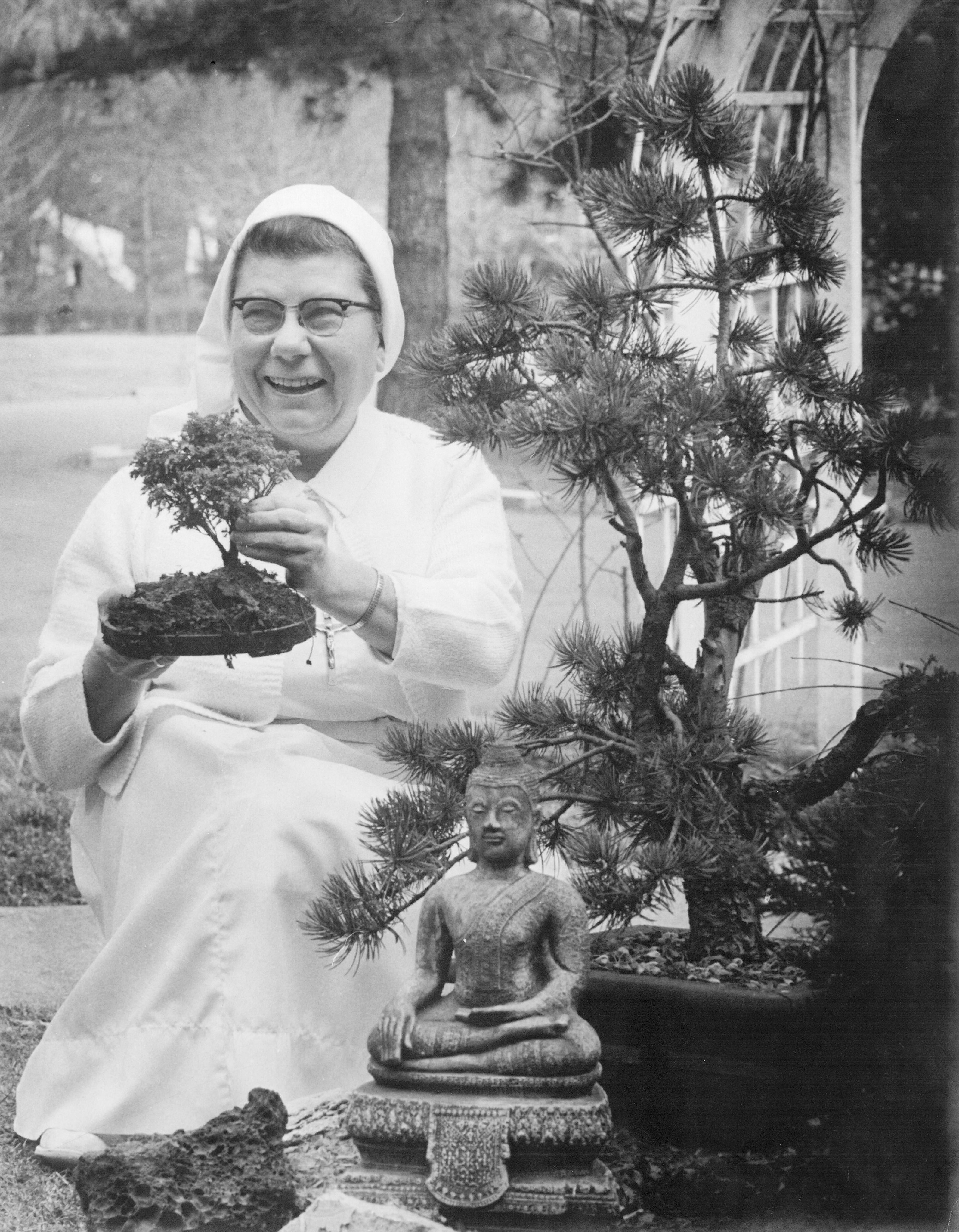 Sister Mary DePazzi, SND USA showing her bonsai trees.